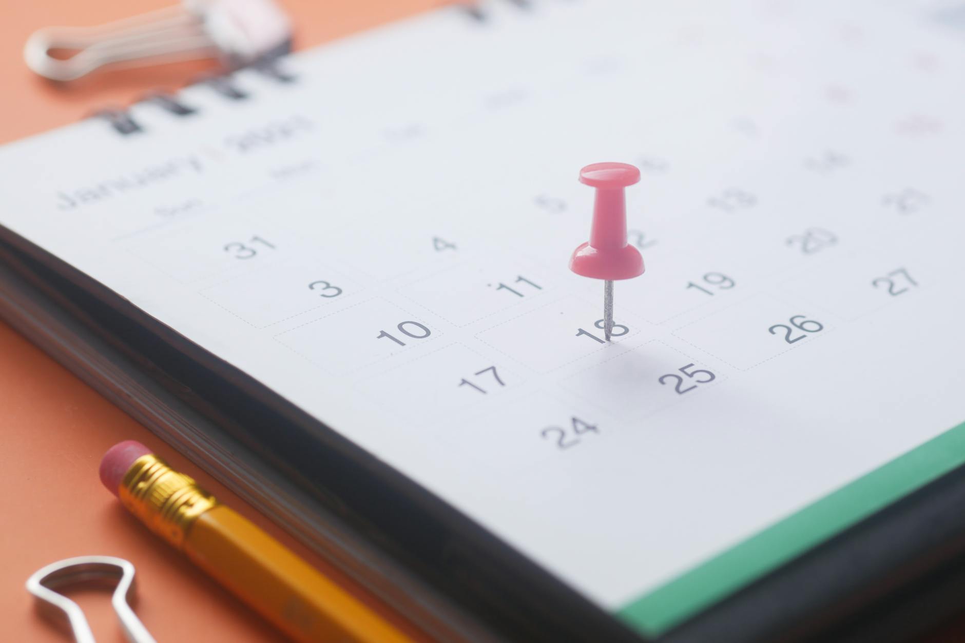 pink pish pin on a calendar